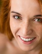 cheerful-redhead-woman-with-freckles-laughing-at-camera.jpg